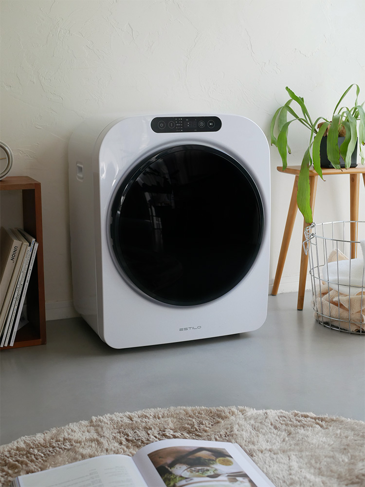 ESTILOのコンパクト衣類乾燥機。白色のプラスチック製で、前面に操作パネルが配置された家庭用電化製品。