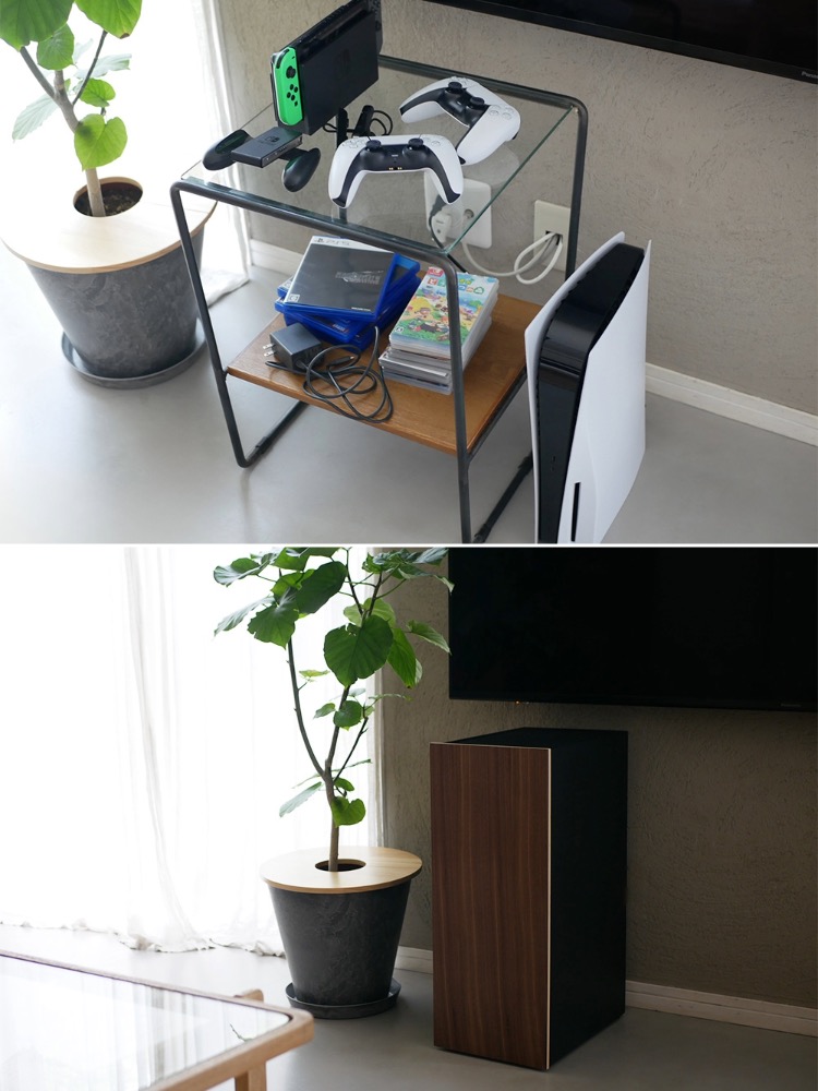 白と黒のタワー型ゲーム機収納ラックがデスク上に配置され、スチール製のフレームと天然木の扉、複数のスライド棚が見える