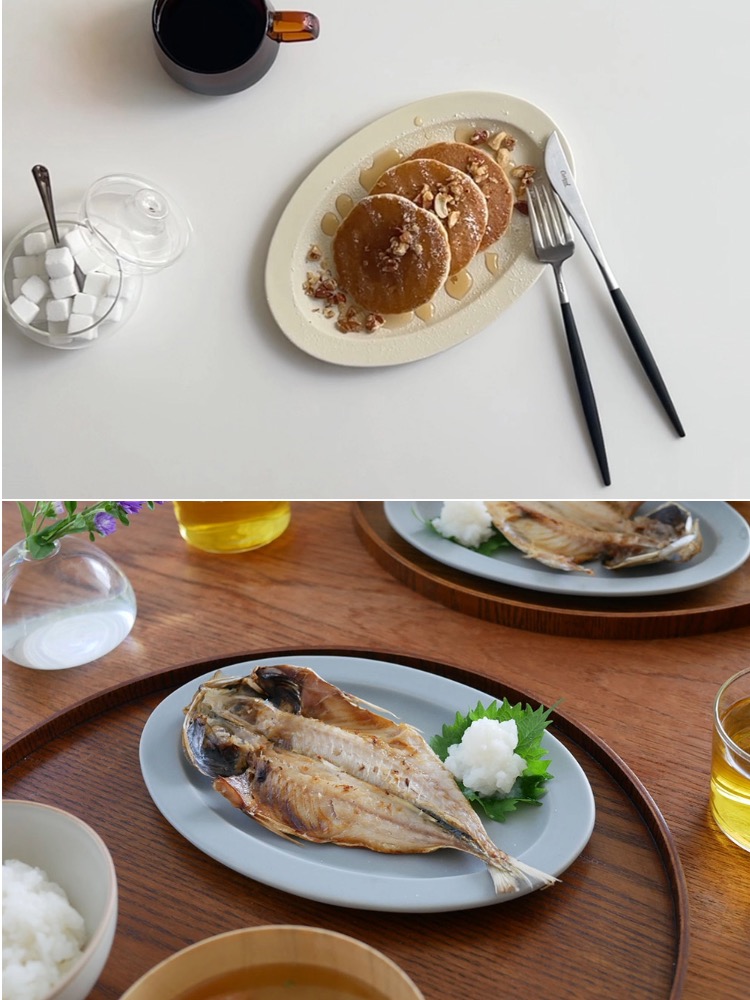 サクザン「Sara」オーバルプレートに盛られた料理と磁器製の食器が整然と並ぶダイニングテーブル