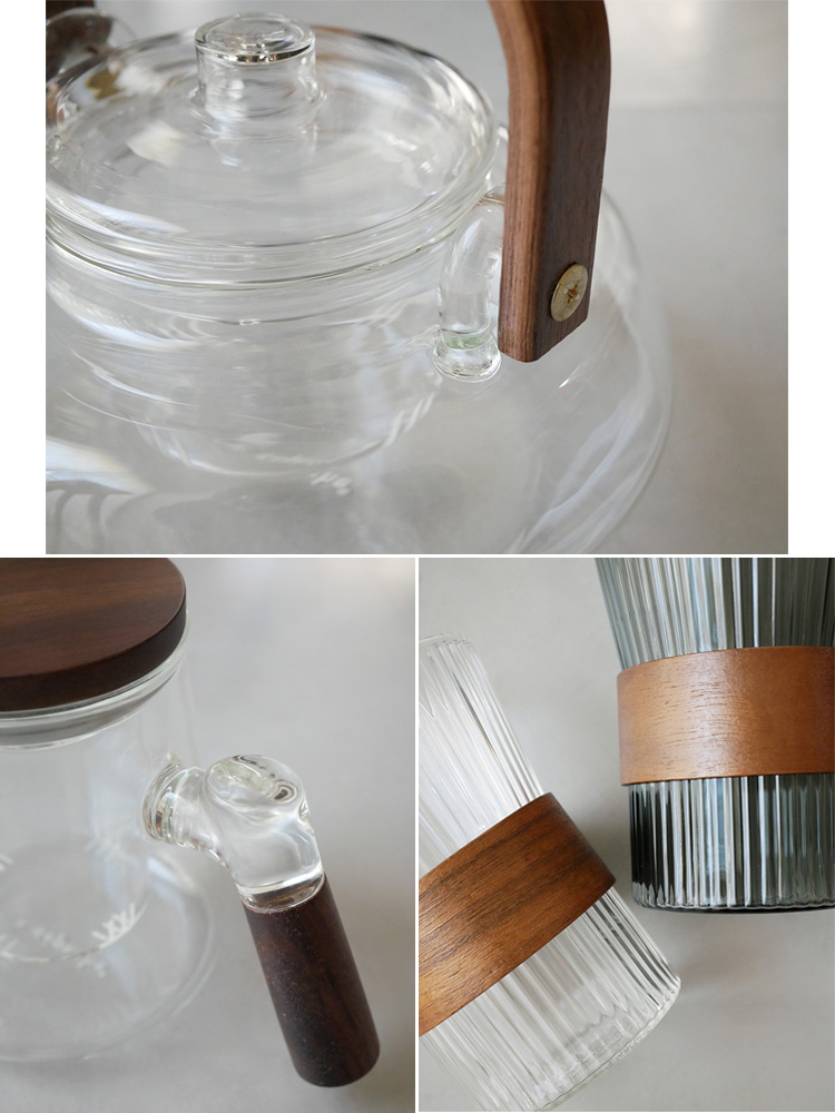 アデペシュのガラスとウォールナット製ティーポット、デザインカップ、コースターが美しく配置された静物写真