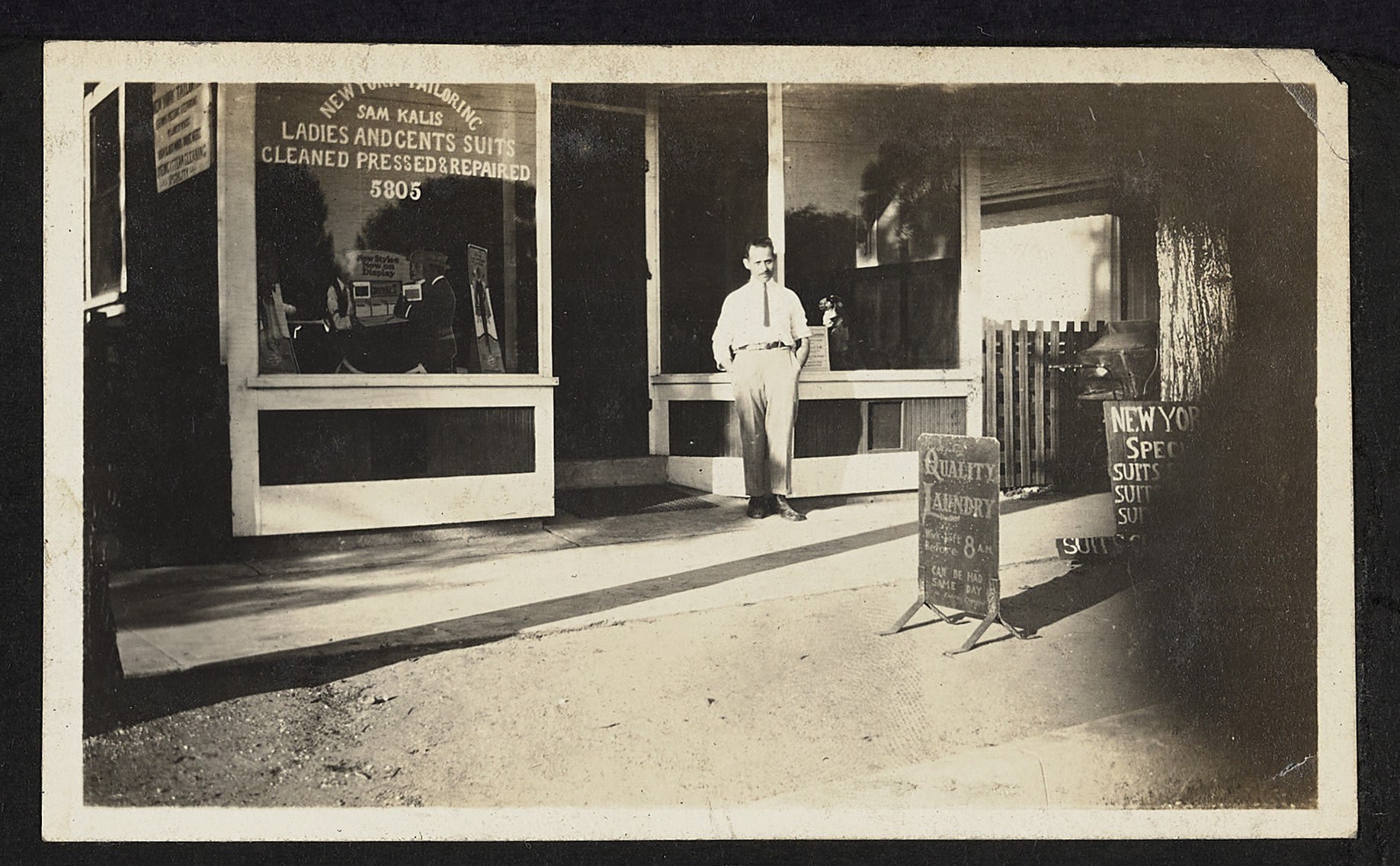 Sam Kalis in front of tailor shop with hands in pocket, Eagle Rock, circa 1920, 1920 (Internet Archive)