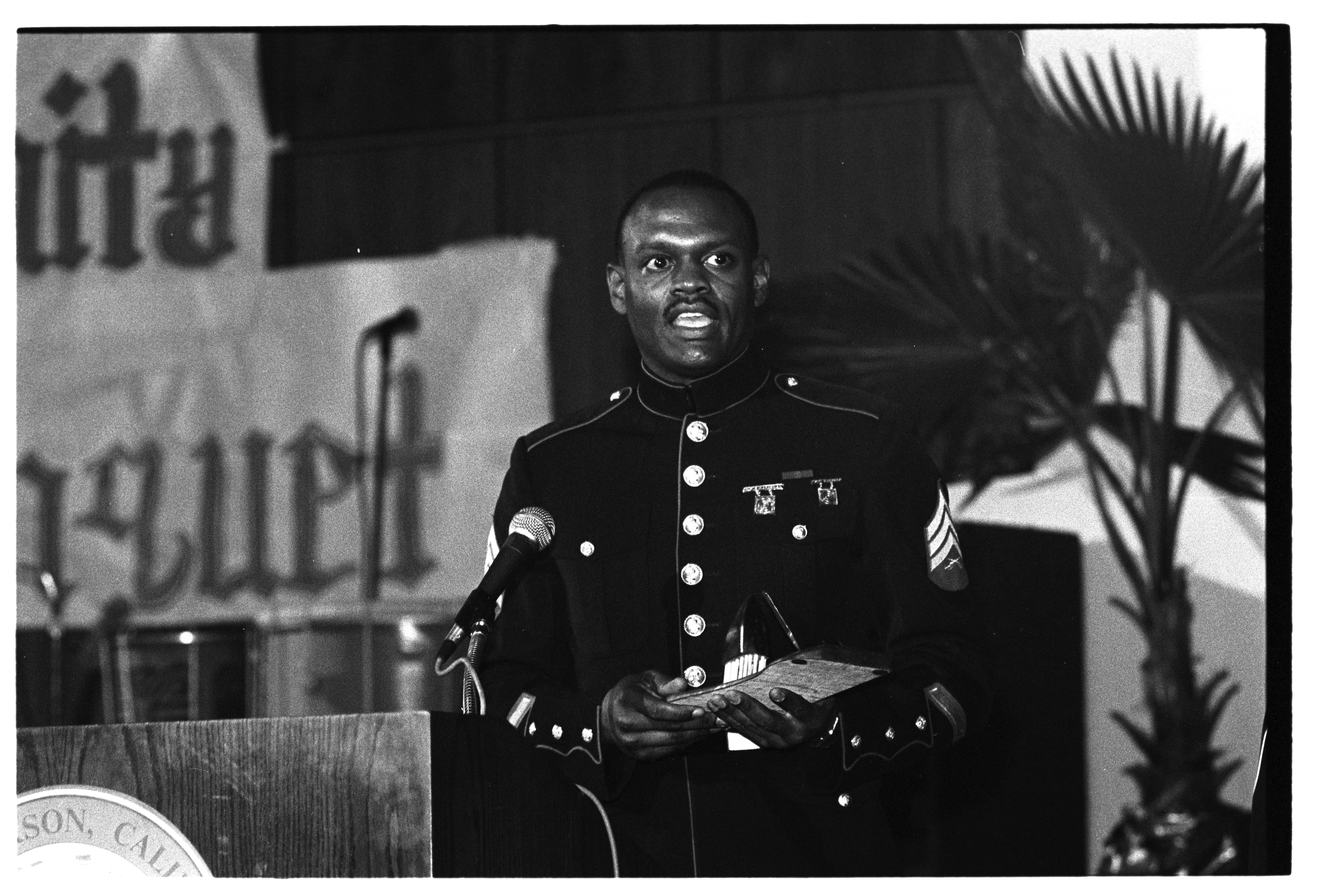 Person in Military Uniform Holding Award, 1905 (Internet Archive)
