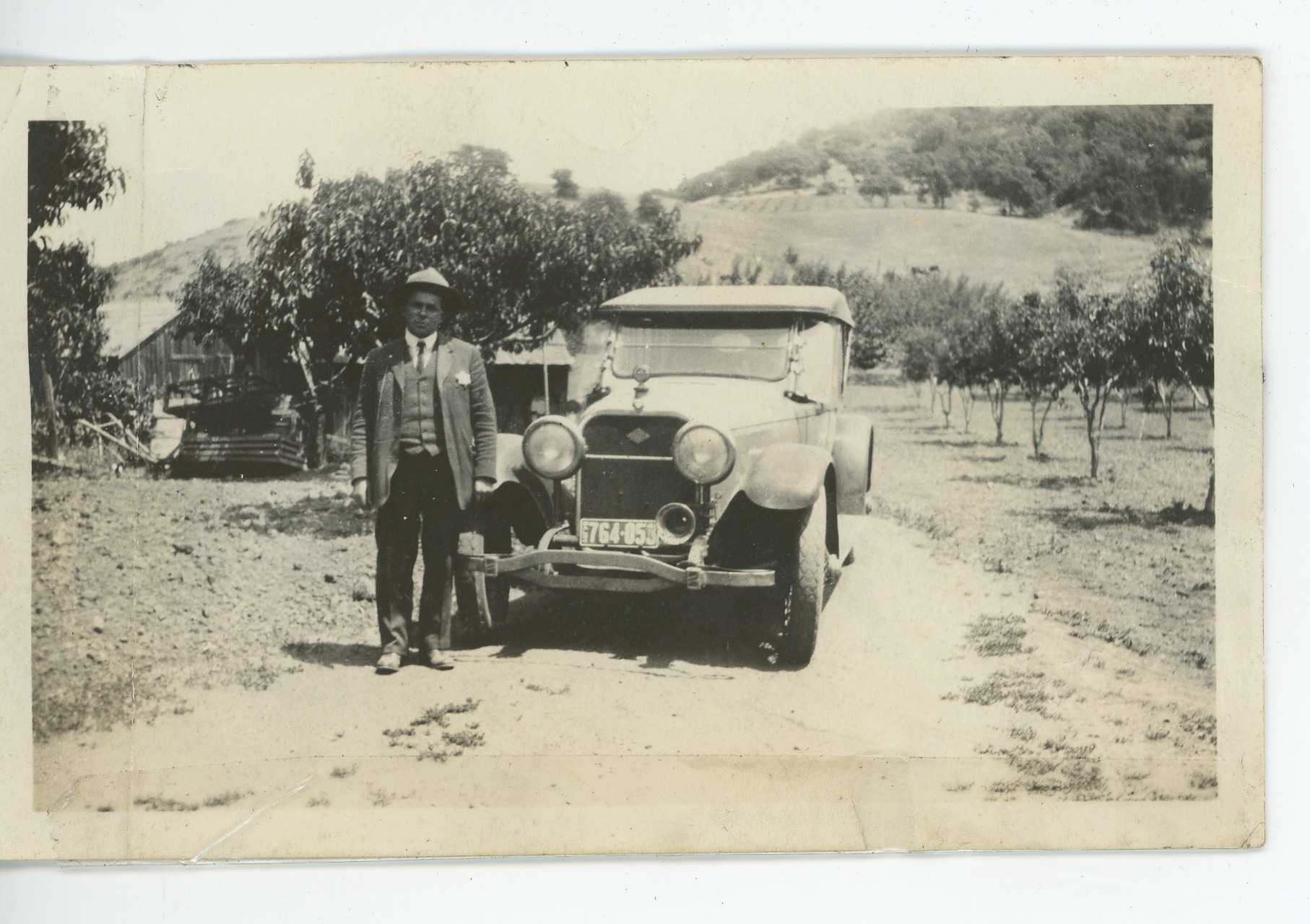 People: Fred DeLucci standing in front of his first car, 1915, 1915 (Internet Archive)