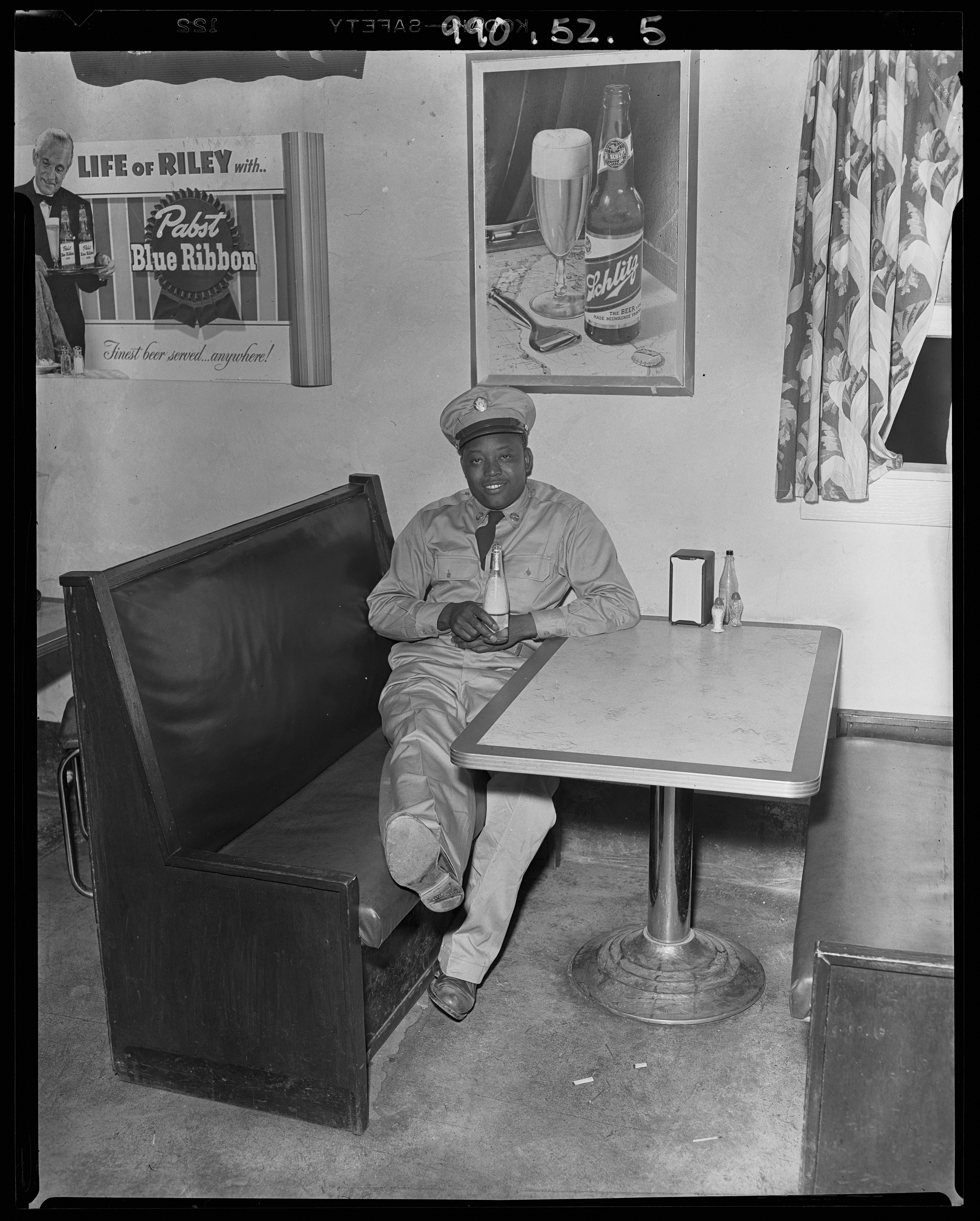Man in uniform drinking, 1916 (Internet Archive)