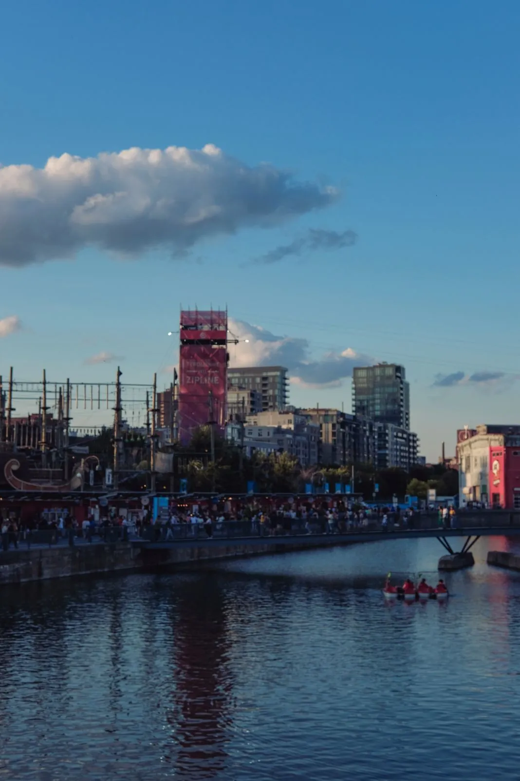 Waterfront skyline view with paddleboats on the water at dusk