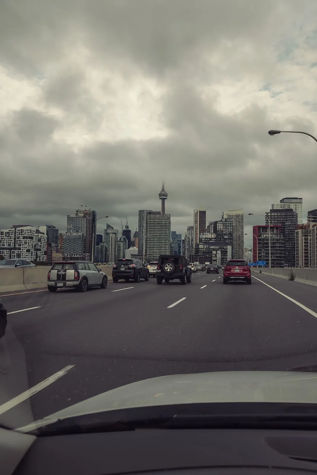 Downtown skyline with the CN Tower seen from inside a car on the highway