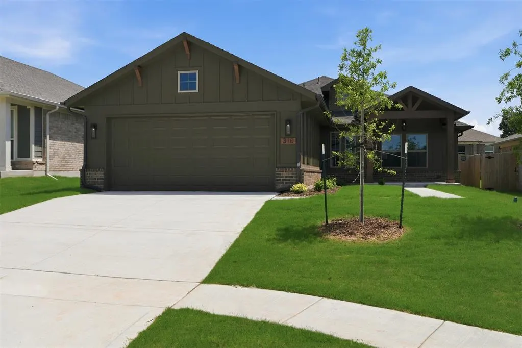 Front exterior — 310 Woodrock Street, Harrah, OK 73045