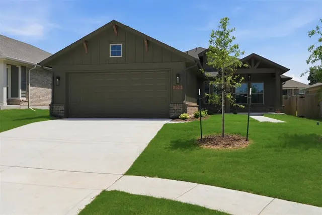 Front exterior — 310 Woodrock Street, Harrah, OK 73045