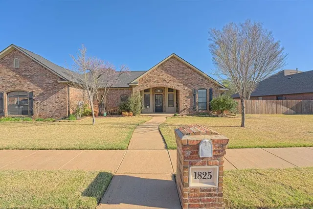 Front exterior — 1825 Tall Grass Court, Edmond, OK 73012