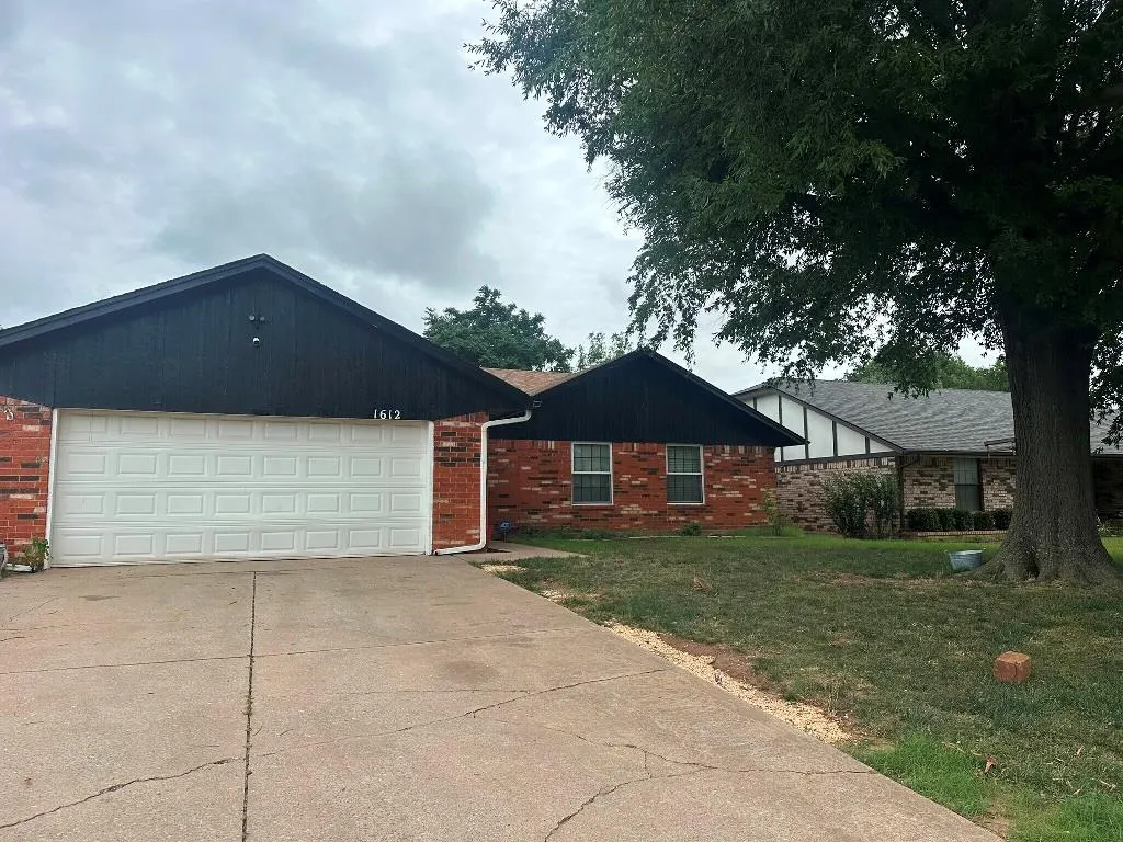 Front exterior — 1612 Whispering Creek Drive, Edmond, OK 73013
