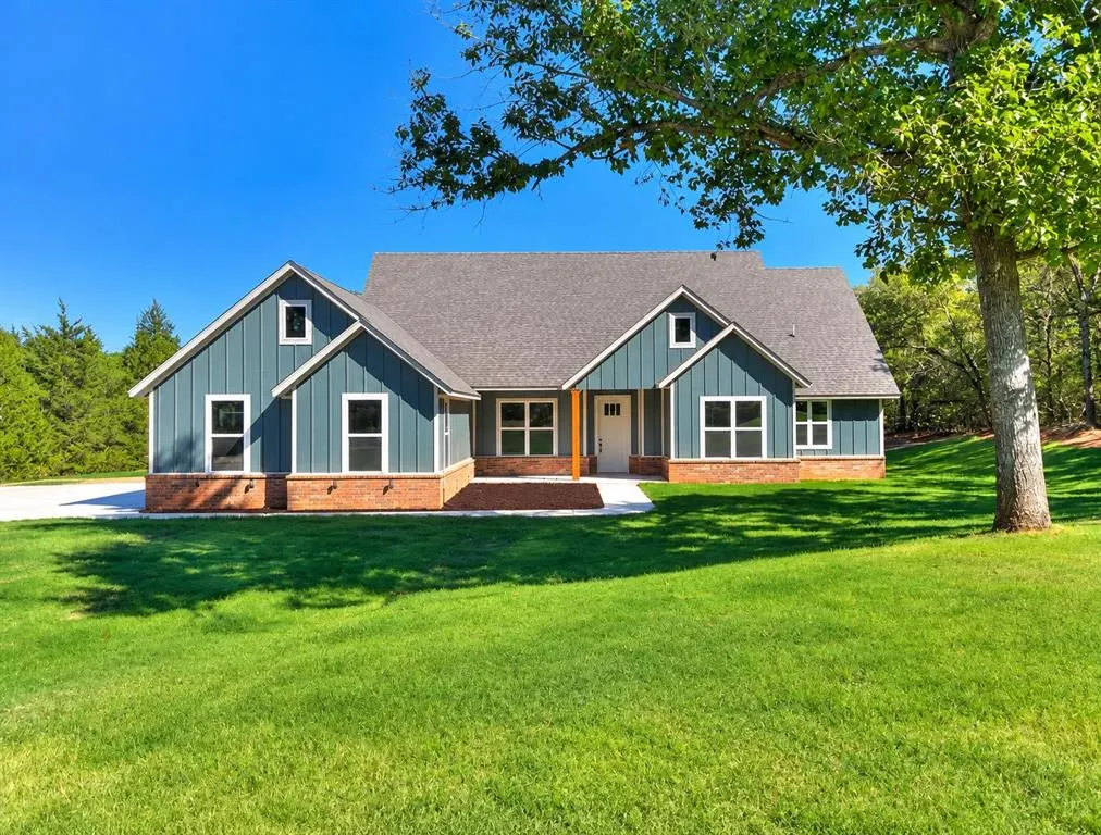 Front exterior — 990614 Hickory Grove Trail, Harrah, OK 73045