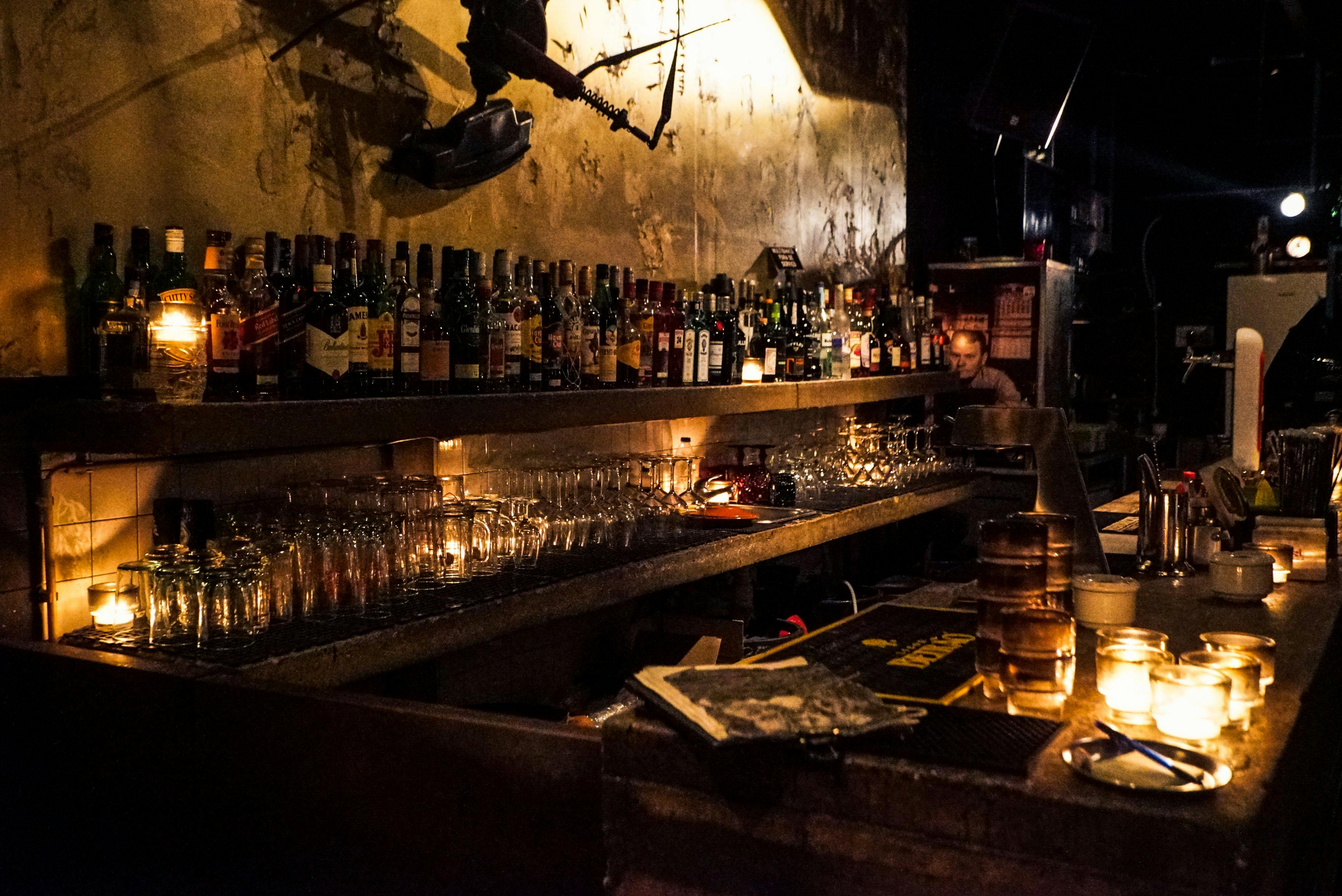 person-sitting-near-bottles
