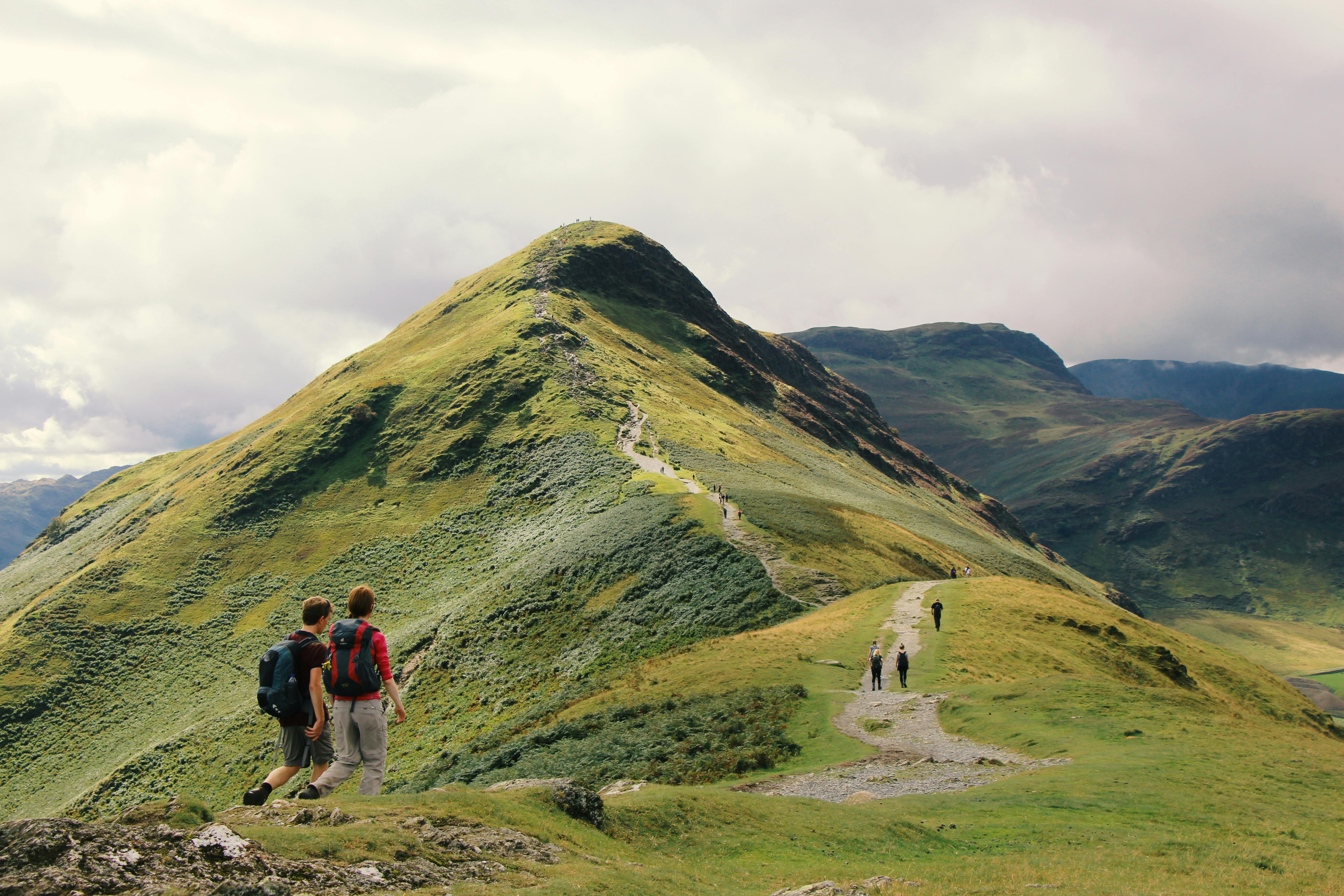 people-standing-on-top-of-mountain