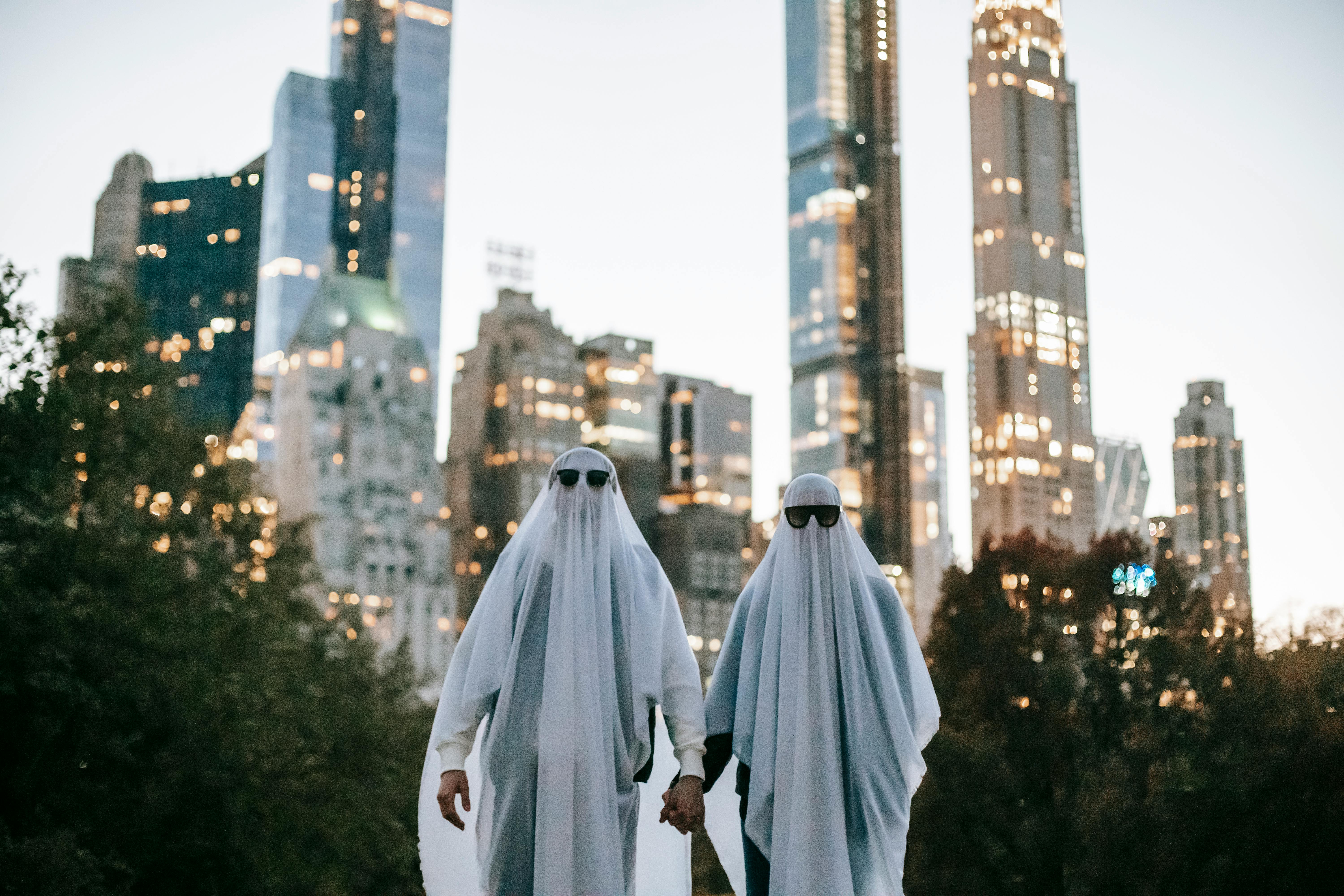 unrecognizable-couple-in-ghost-costume-on-street