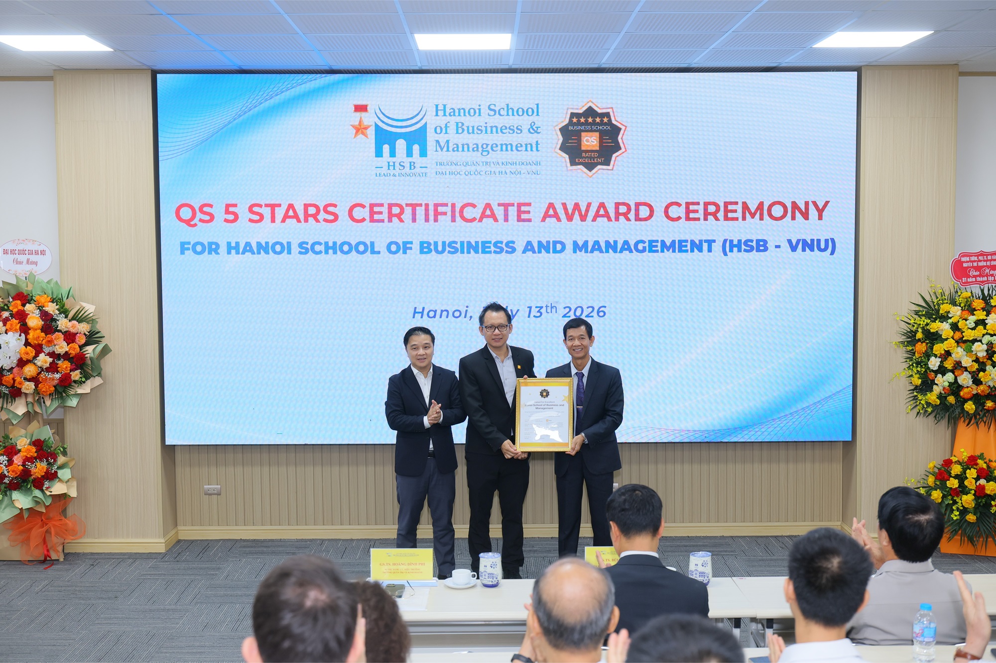 QS representatives presenting the QS Stars 5-Star rating certificate to HSB