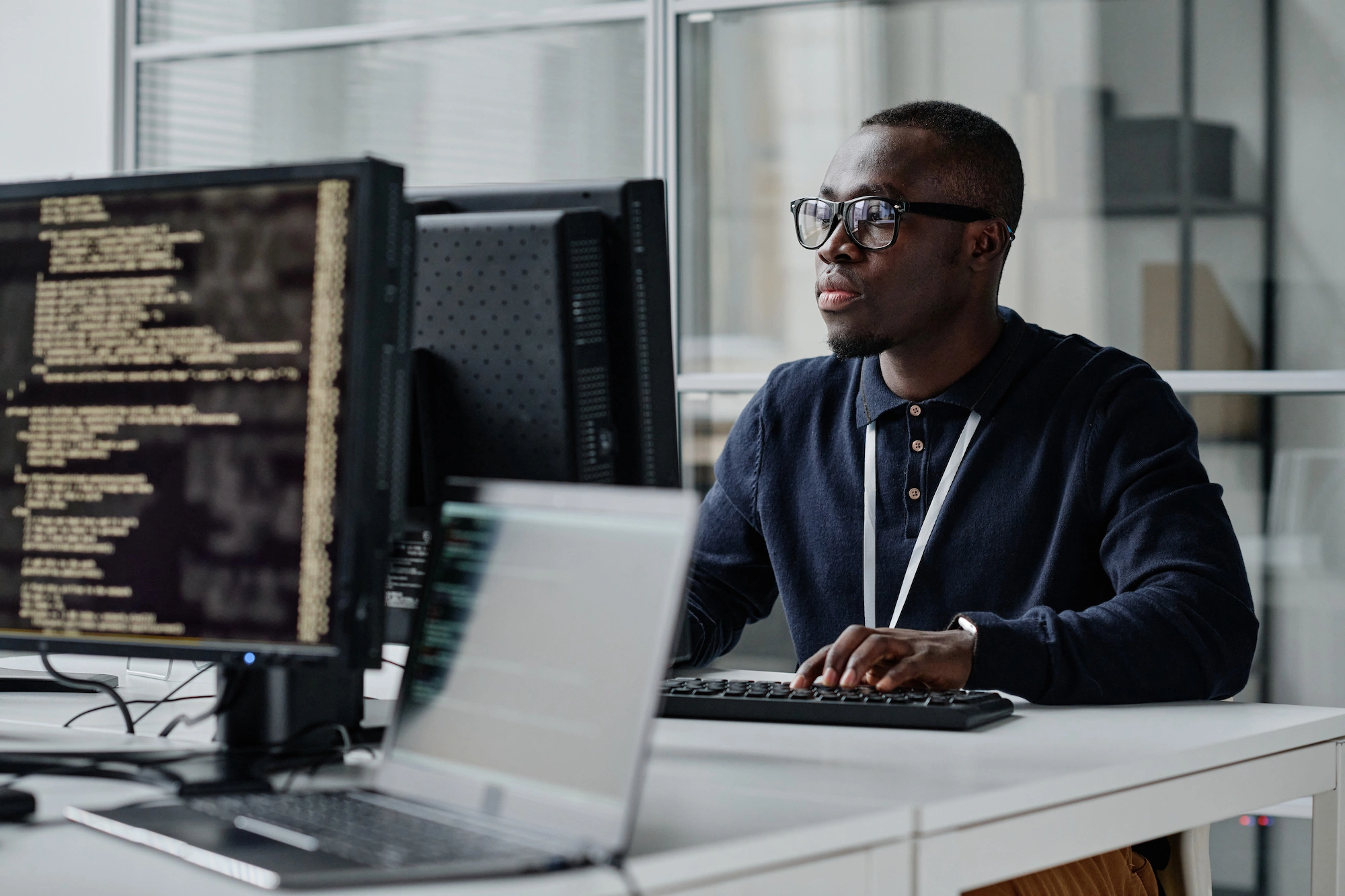 A cyber security specialist working at a computer