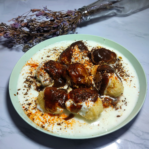 Dahi Vada / fritters in curd  