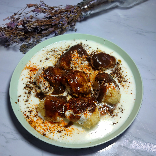 Dahi Vada / fritters in curd  