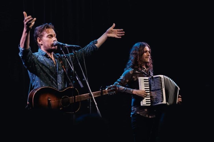 May be an image of guitar, accordion and violin