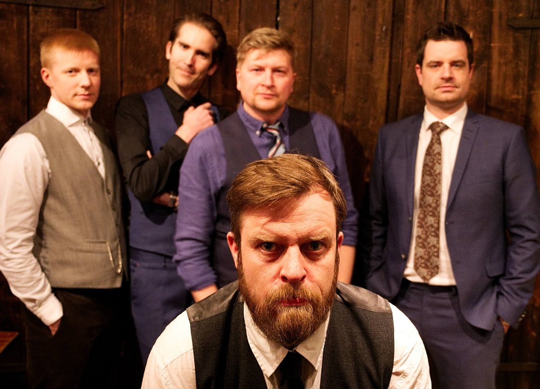 May be an image of one or more people and beard