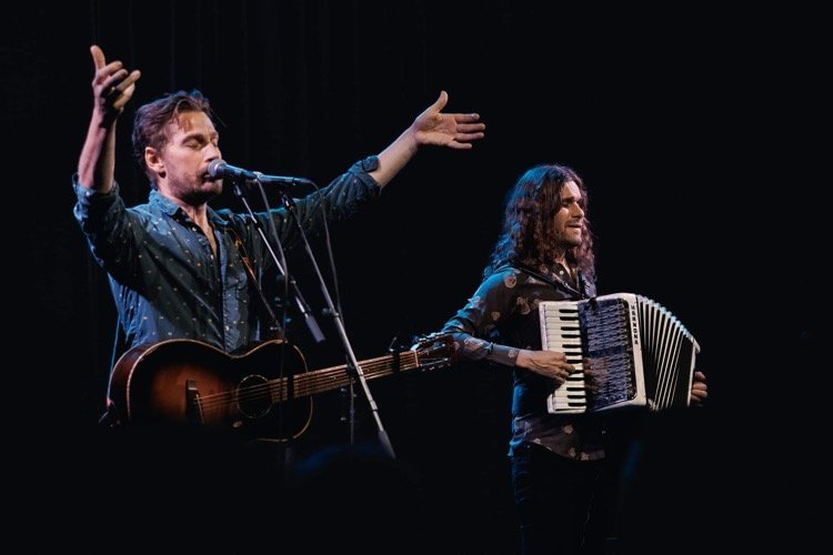 May be an image of accordion, violin and guitar