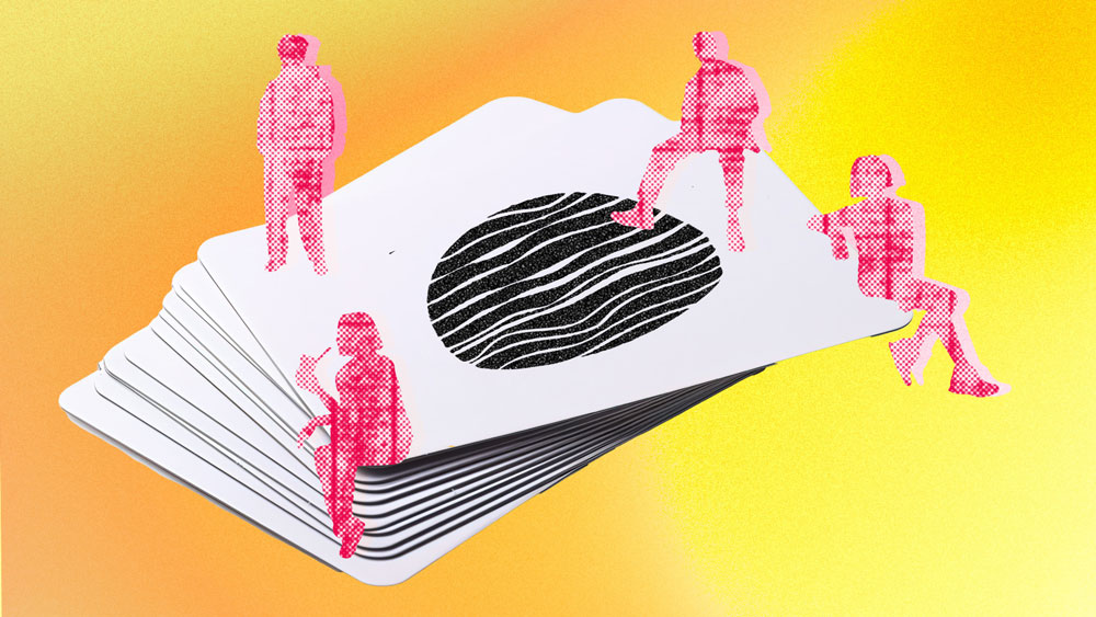 Red silhouetted figures sit or stand on a stack of oversized cards. The cards, with abstract black shapes in the center, rest on a gradient background of yellow and orange, evoking thoughts of decision-making or building foundations with the help of multiple perspectives.