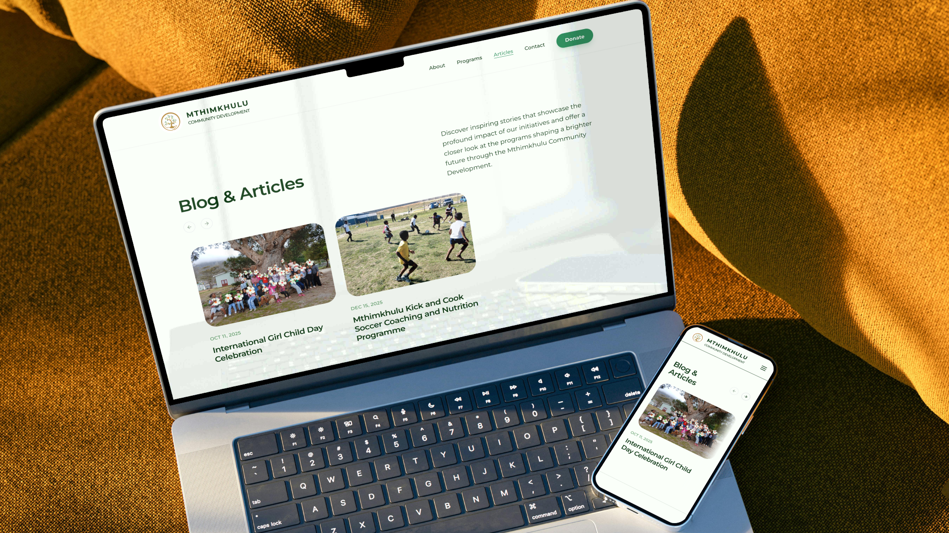 Dual screen mockups showing the clean grid archive for the Mthimkhulu Blog and Articles section with post thumbnail cards.