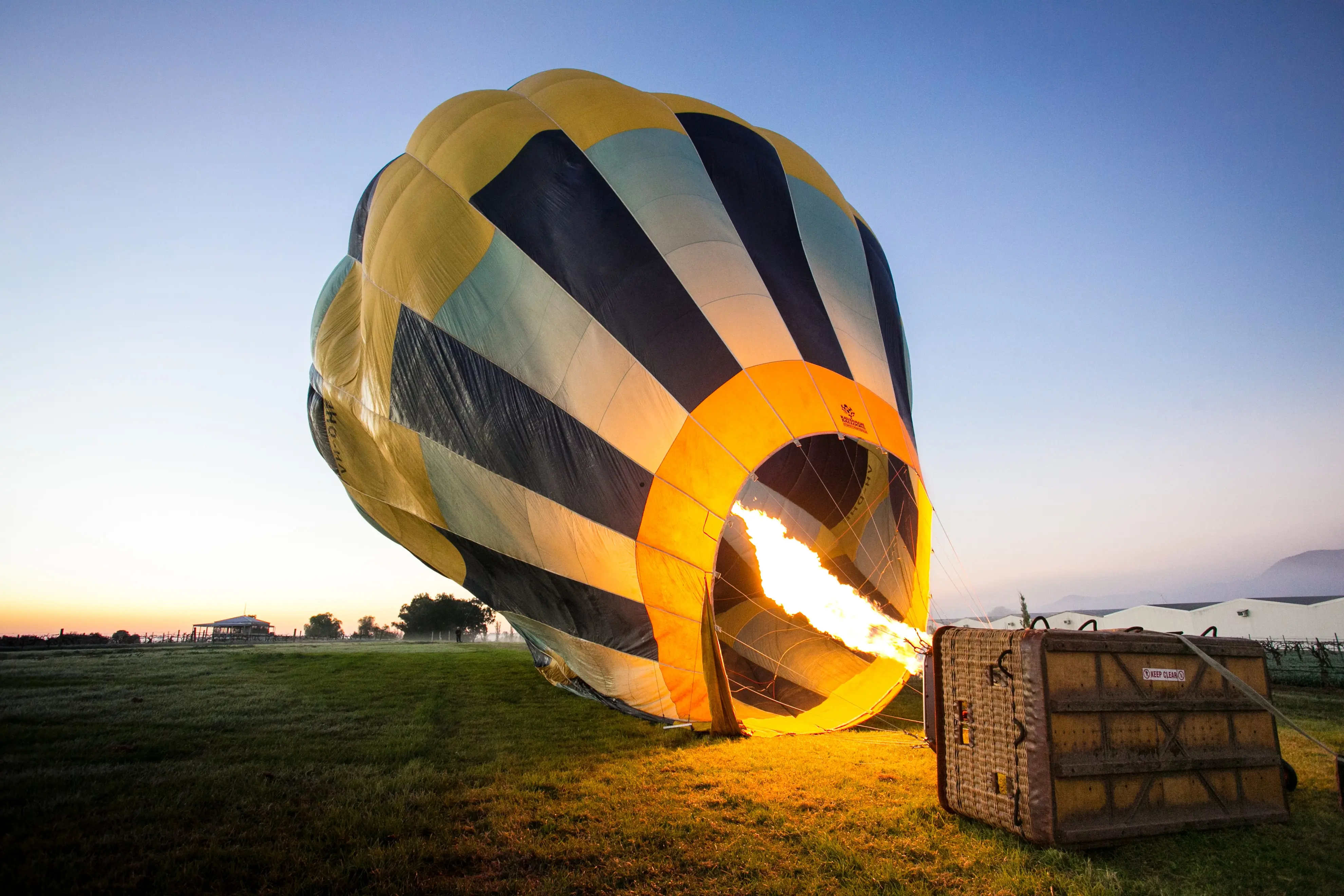A hot air balloon being inflated to take flight.