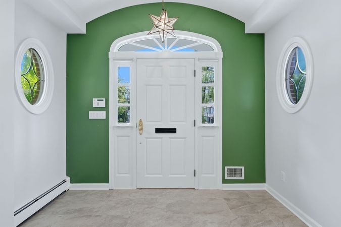 1a-Entry Foyer with Stone Floor & Chandelier