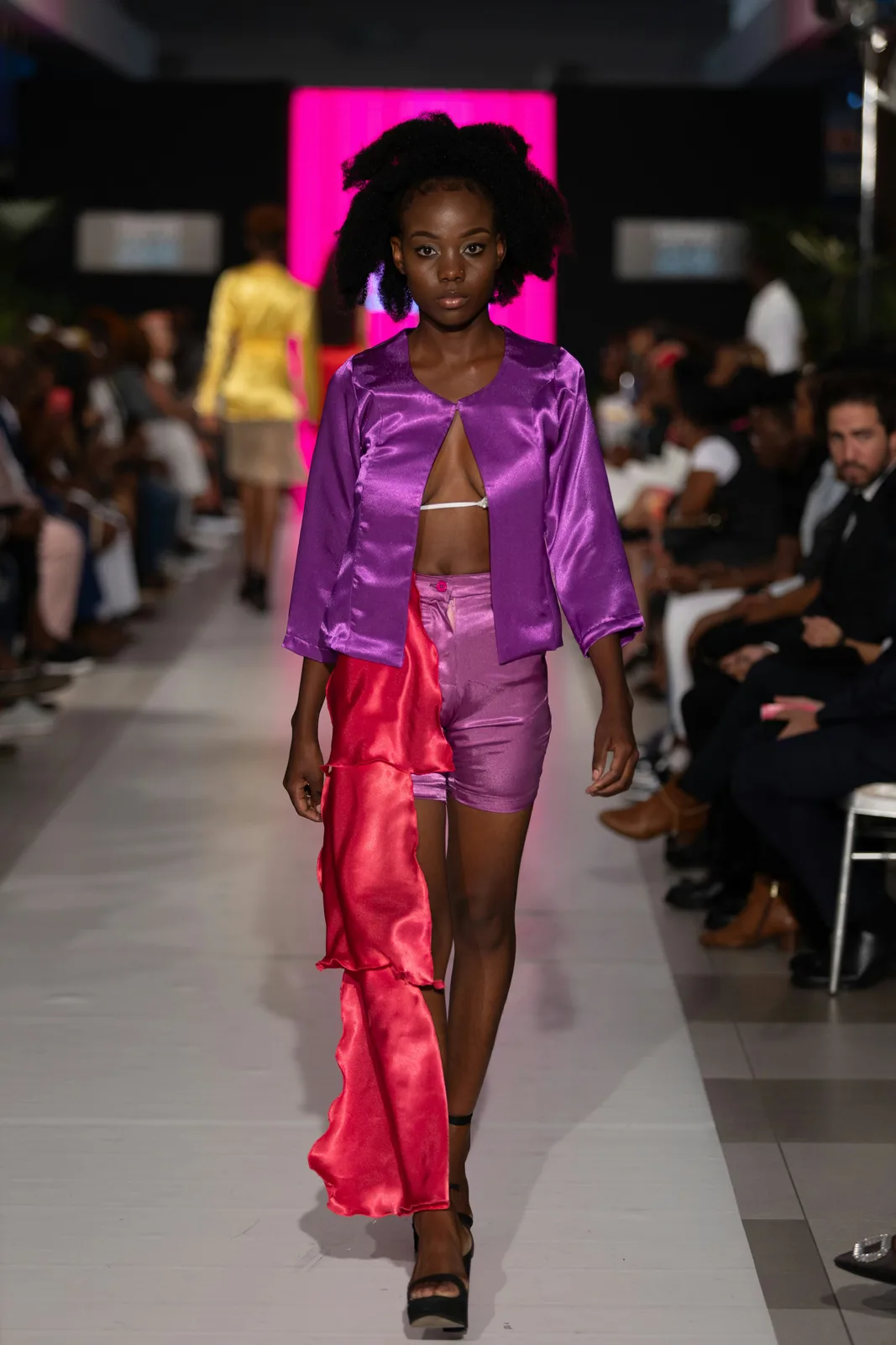 Model walking a runway, the training pipeline now feeding UGC work