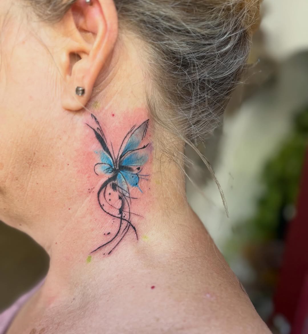 Colourful neck tattoo done by @jasonjohannestattoos