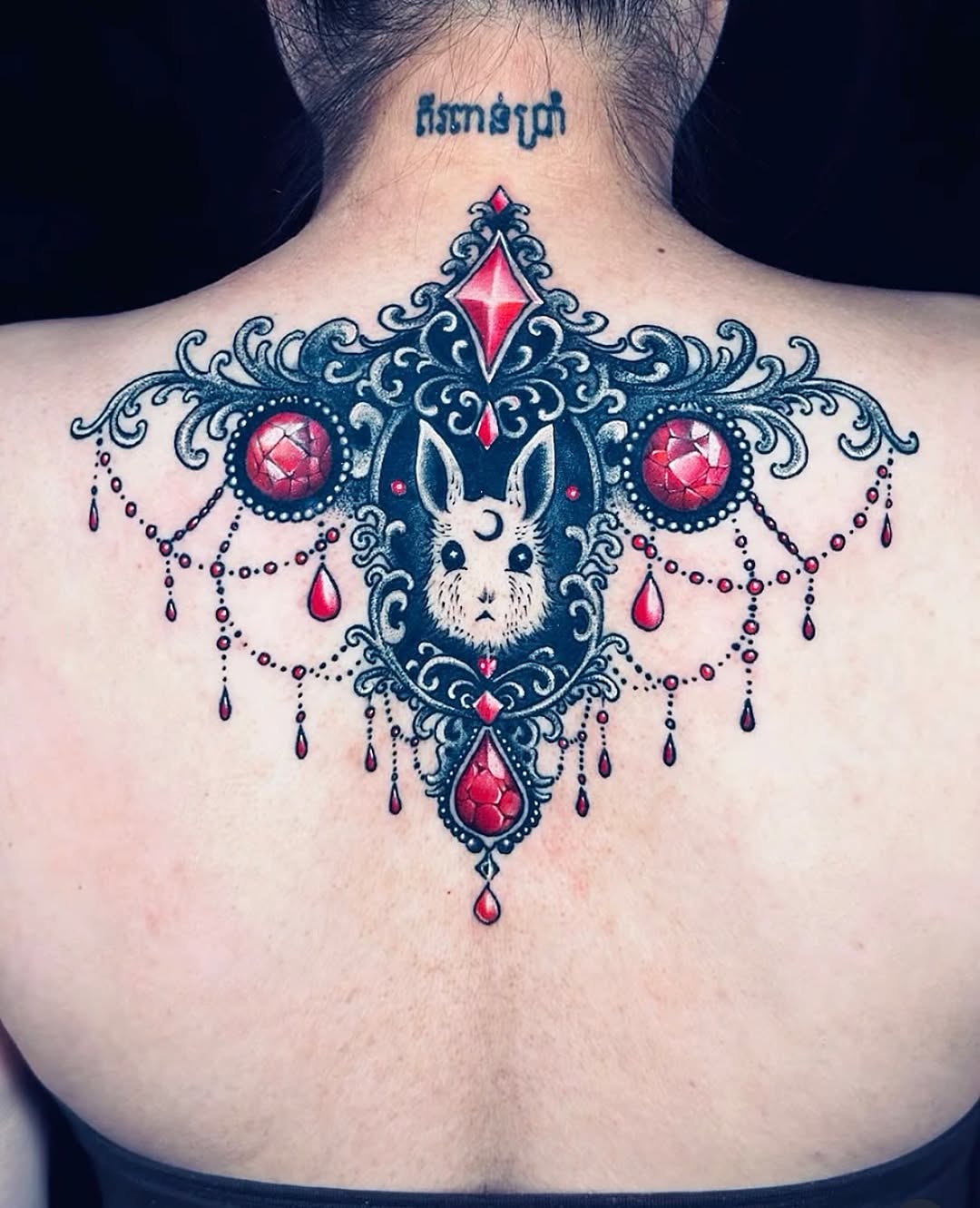 From unwanted to unforgettable 

This cover-up transforms an old tattoo into a refined ornamental piece — centered with a delicate rabbit motif, surro