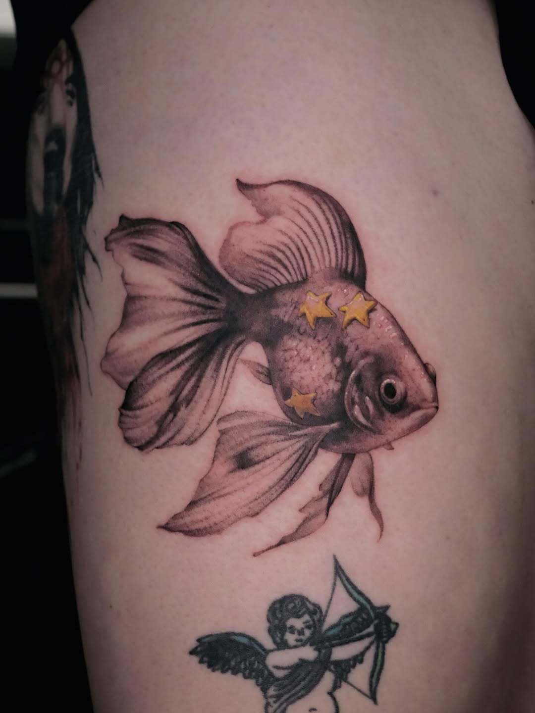 8/11 of my convention pieces from last year - I’ve wanted to tattoo a goldfishy like this for SO LONG so I said fuck it and @fallen_tattoos so graciou