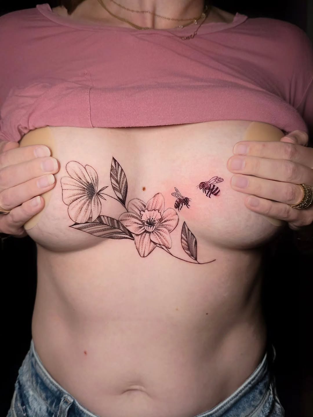 Clean, delicate,

Fine line florals flowing naturally across the chest with soft whip shading and subtle detail work to keep everything light, feminin