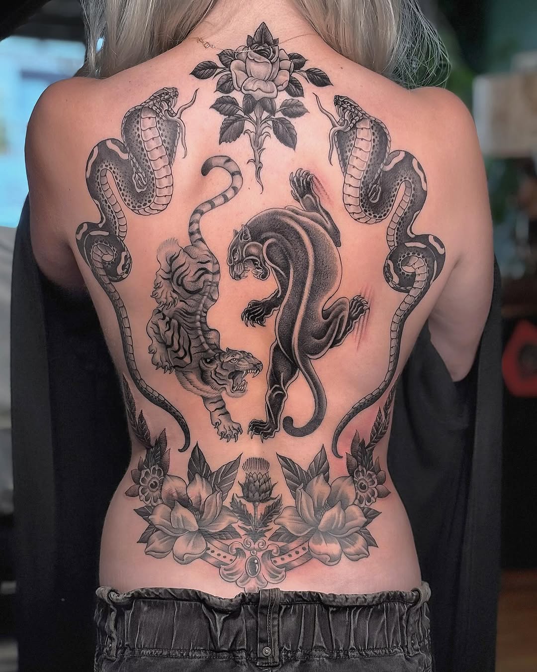 Chippin away at this duel cobra, Tiger and Panther back piece for Courtney! Mostly healed all done using #sombragrays - adding more floral work next s