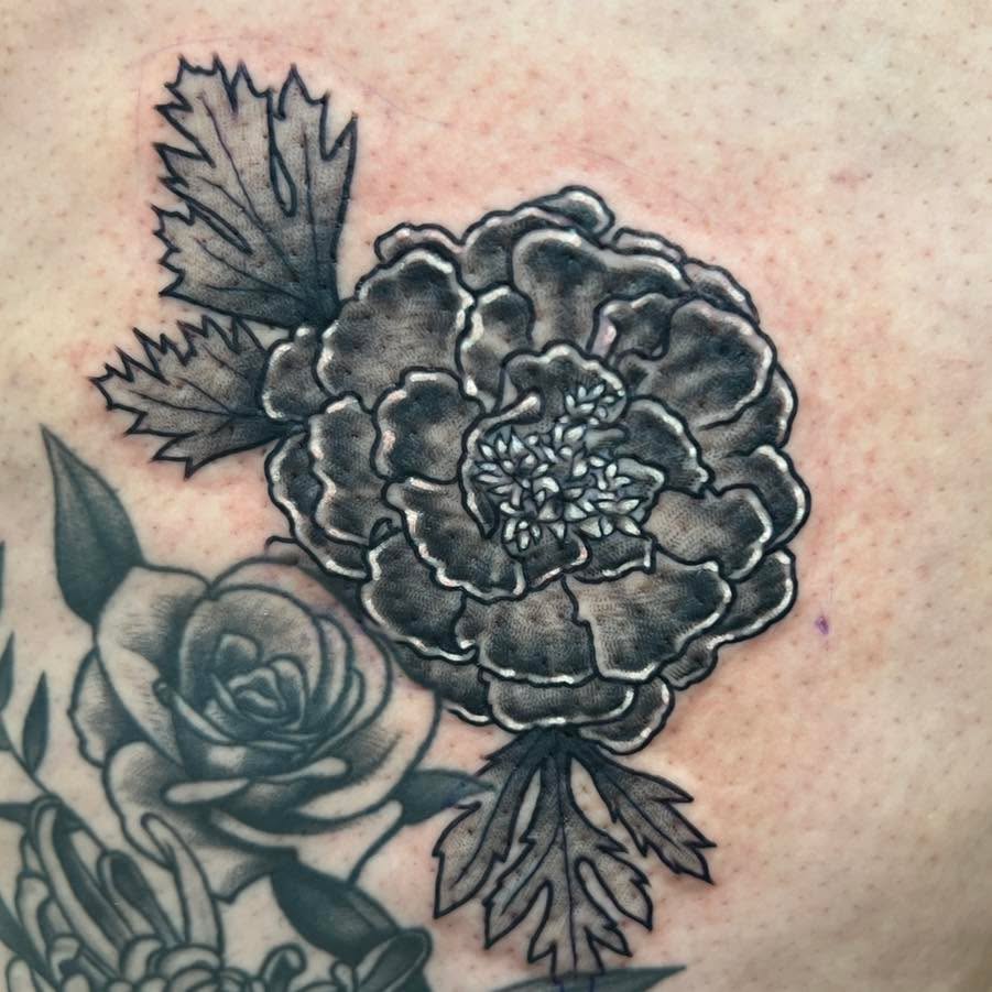 I recently added a fresh new marigold to the rose and chrysanthemum he did for Jasmine a few years ago. 

 www.dqtattoos.com
✉️ dustinquillentattoos@g