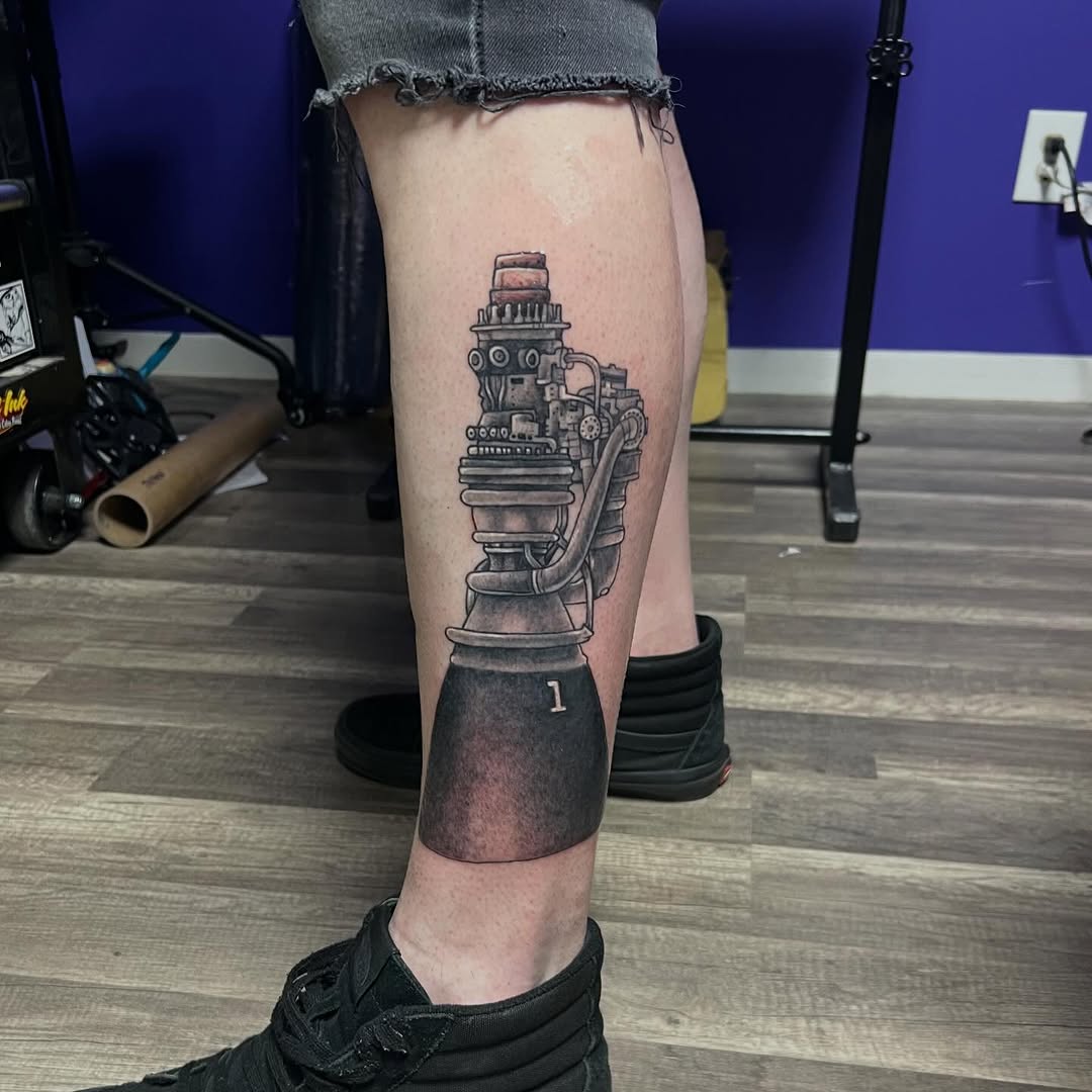 Super fun tattoo here  a rocket engine from our space program , this is basically healed I just darkened up the booster portion today . 
.
 This was a