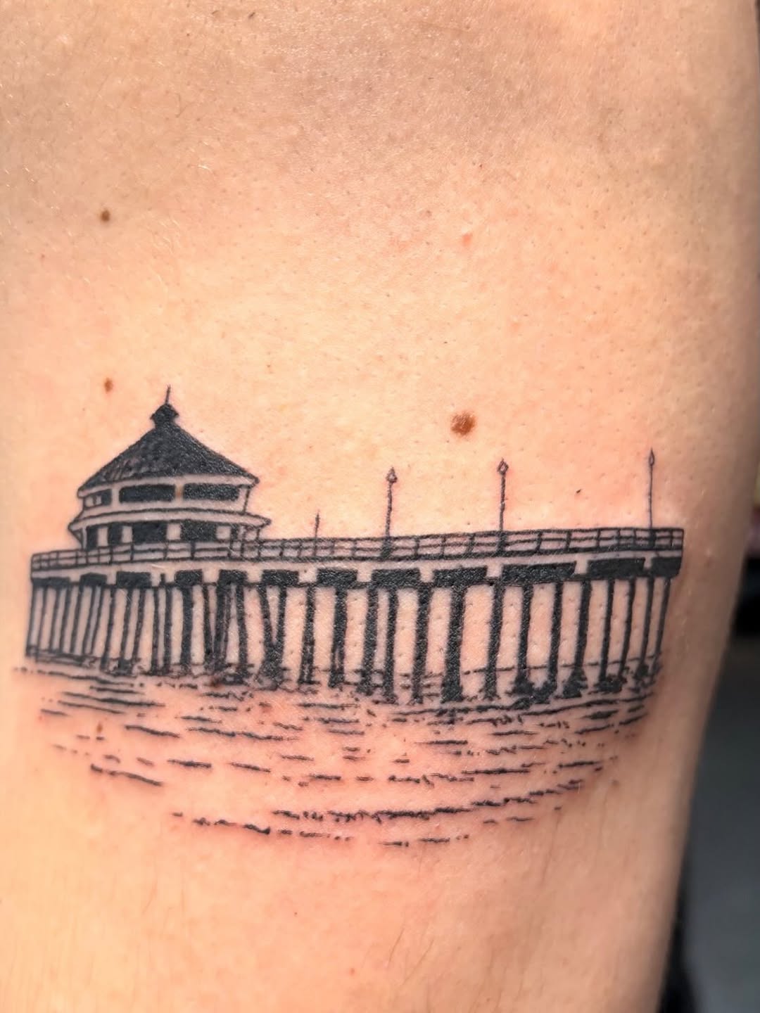 #hbpier #huntingtonbeachpier #blackworktattoo #femaltattooartist #armtattoo  Here’s a nice tattoo of the pier I did for a client that’s moving out of 