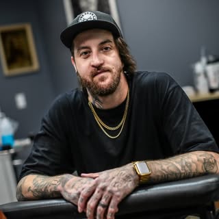 Lincoln Tattoo Company - Soundwave tattoo artist in Macomb, United States