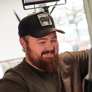 Ohio Tattoo Artist - Christopher Powell - Soundwave tattoo artist in Springfield, United States