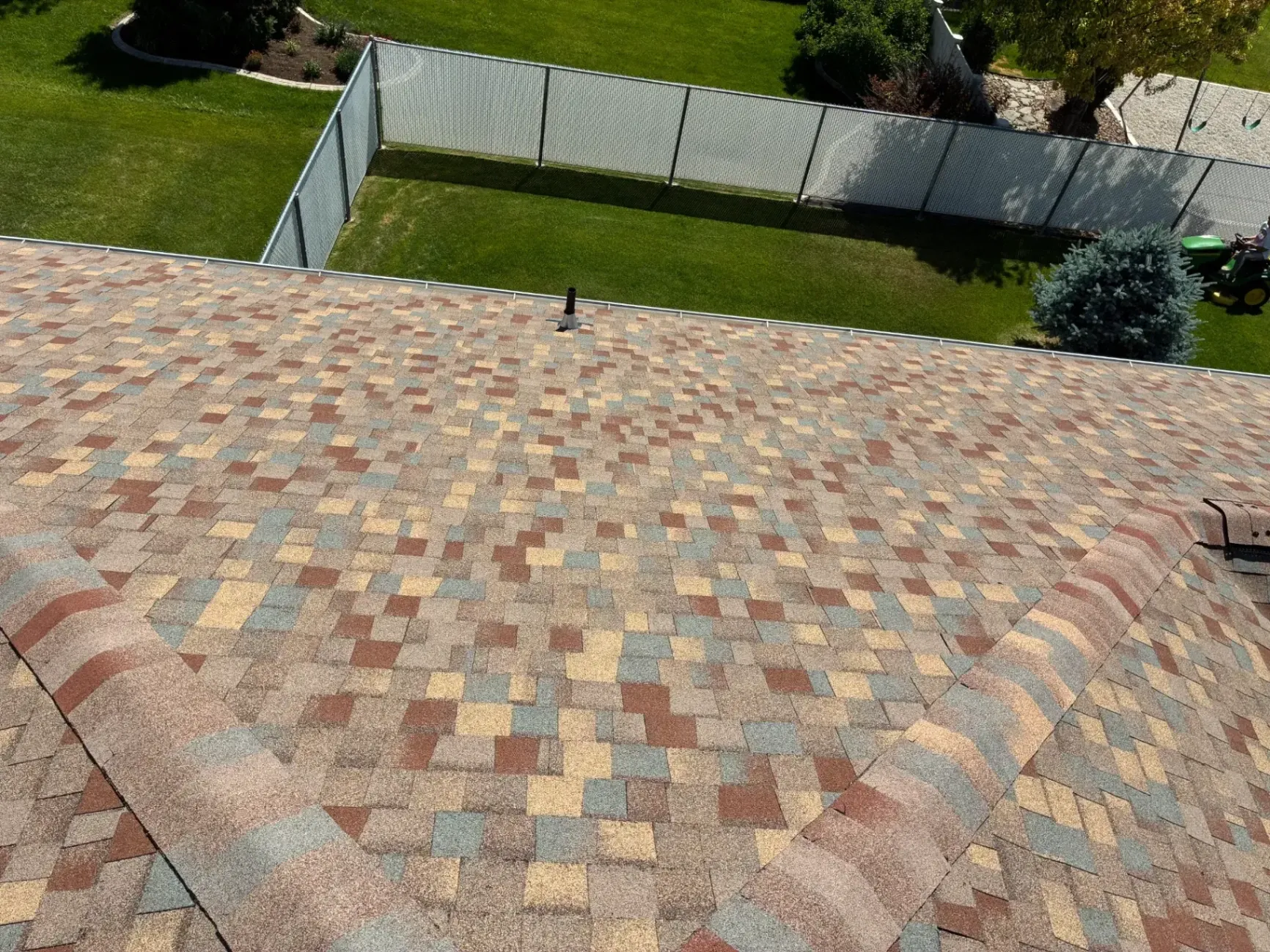 Newly installed multi-tone asphalt shingle roof backed by warranty, completed by North Point Roofing LLC in South Ogden, UT.