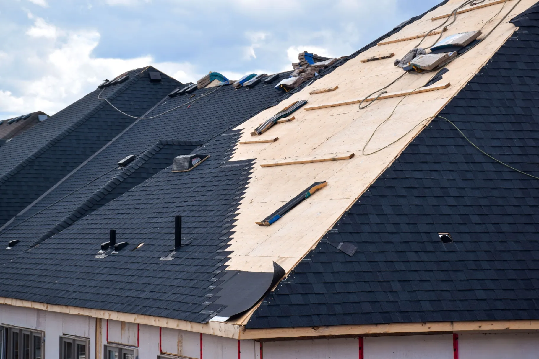Shingle roof installation on a new residential house