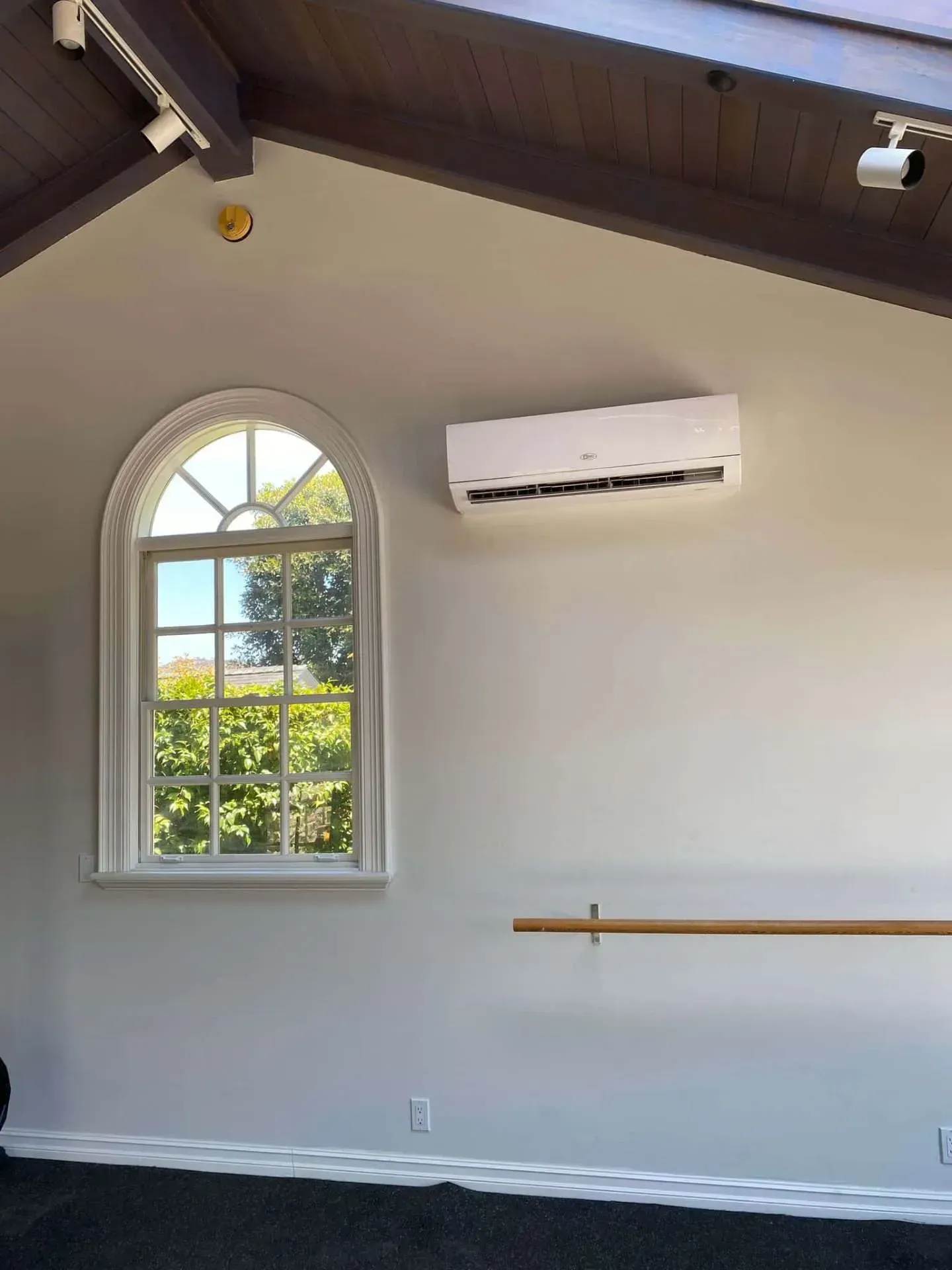 Wall mounted ductless mini split installed in a bright room for efficient cooling in Anaheim.