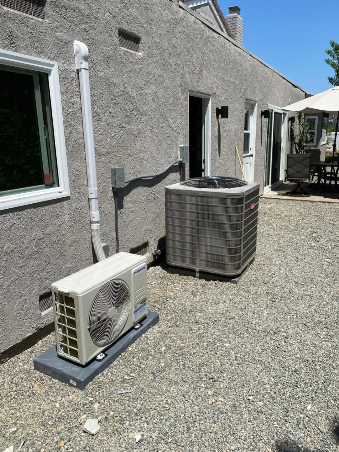 Outdoor AC units installed beside a home for professional AC installation in Westminster, CA