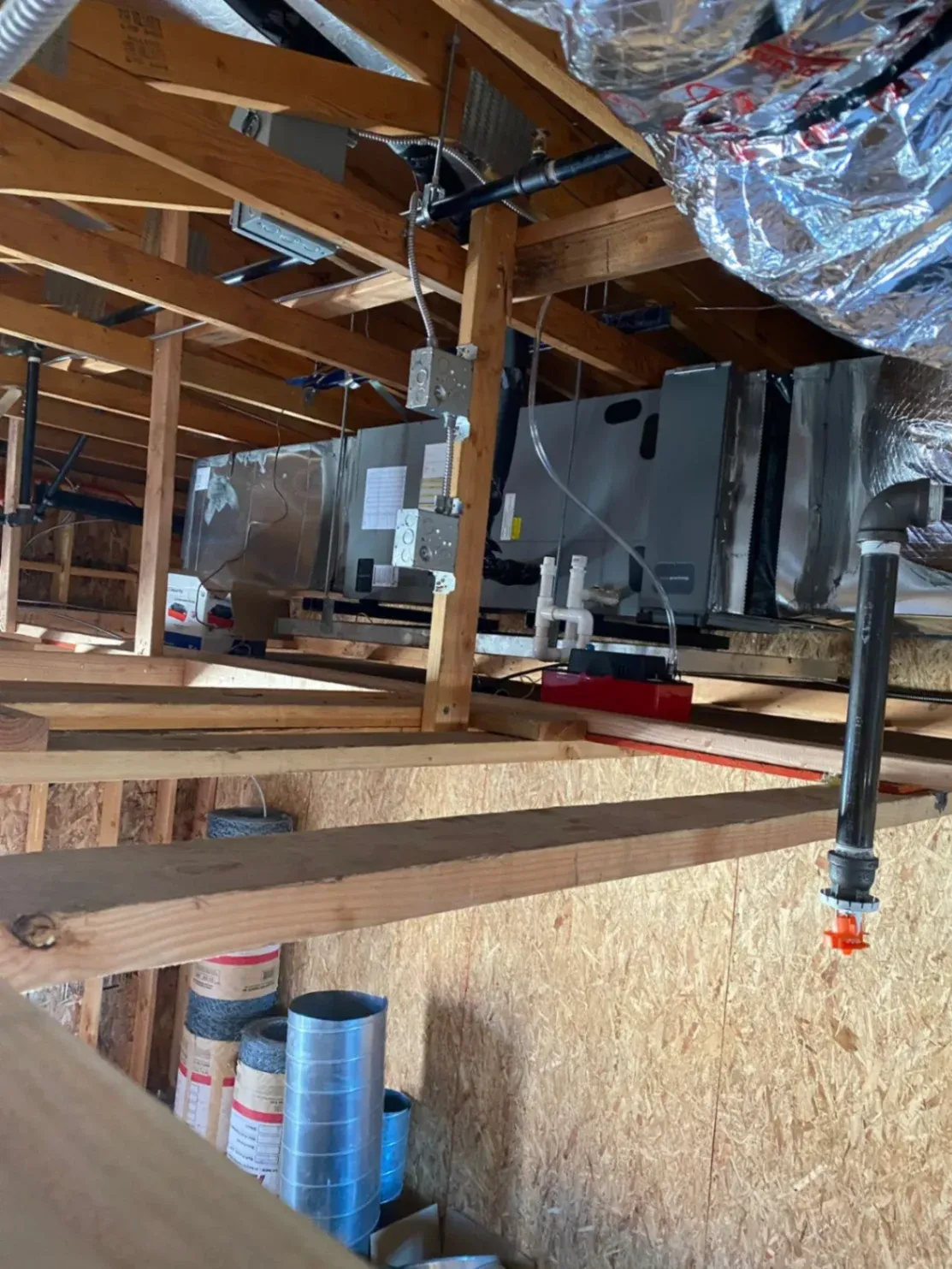 Technician adjusting an indoor HVAC unit during an AC tune-up in Westminster.