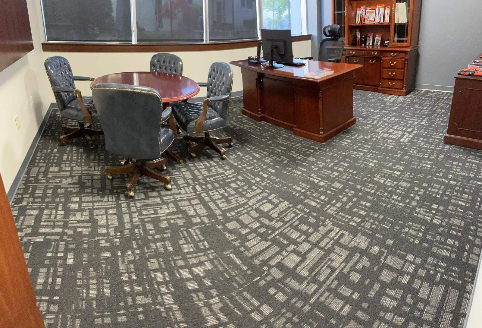 Clean office space with freshly vacuumed carpet maintained by commercial cleaning services.