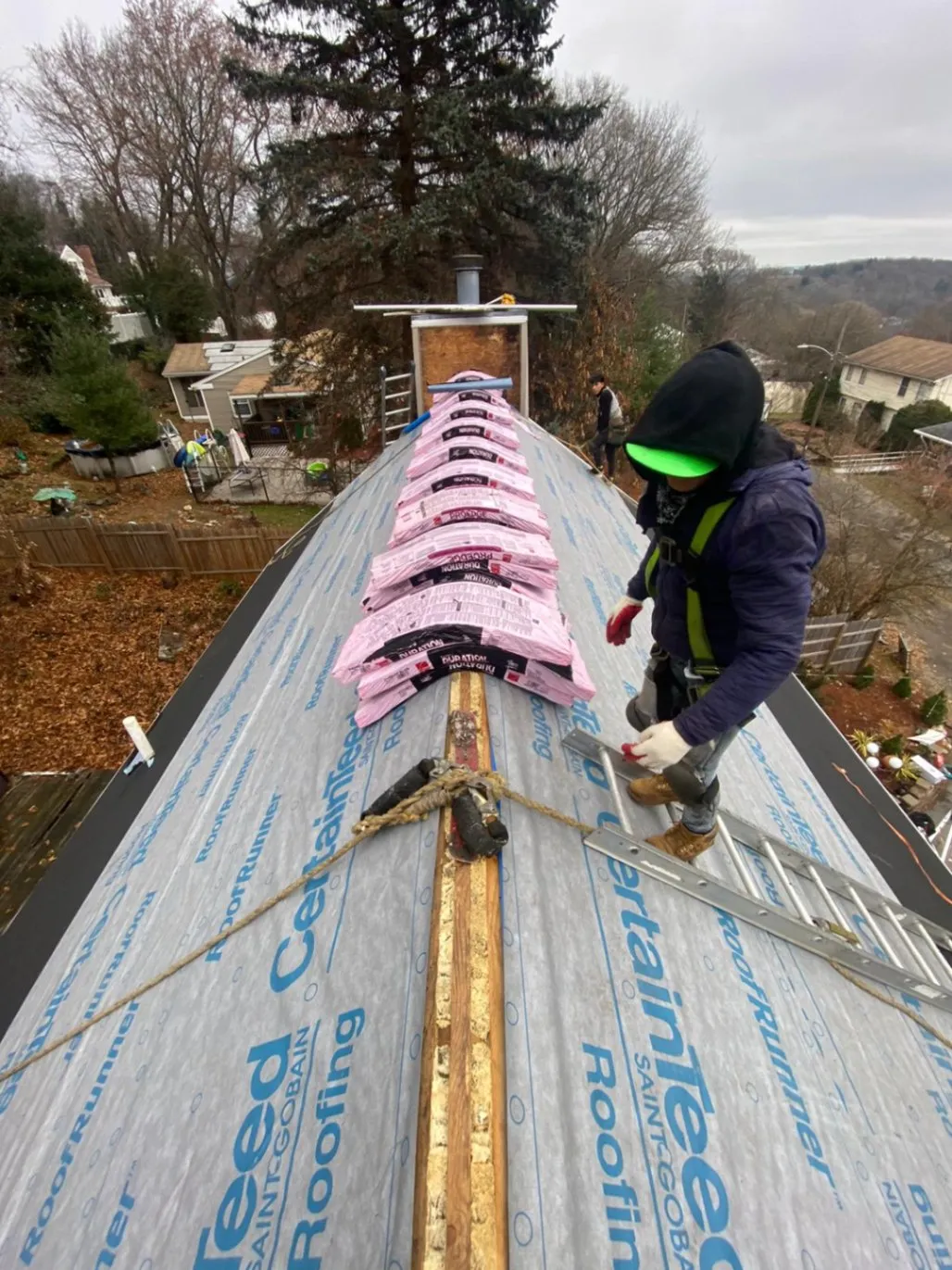 Certified roofing team from JM Exteriors Roofing Siding installing Owens Corning Duration shingles over high-quality synthetic underlayment for a durable roof replacement in Westford, MA.