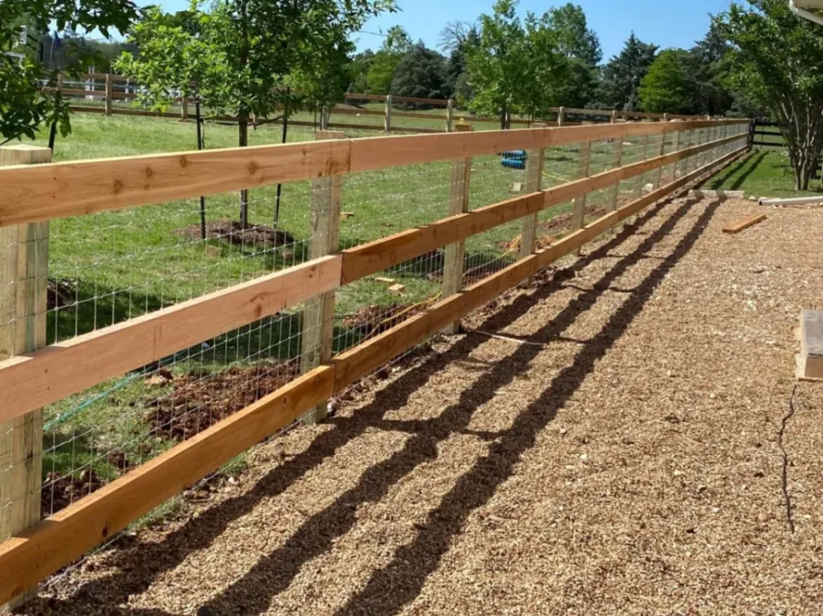 3 Rail Fence with Metal Wire Mesh in a Ranch of Spring Branch, TX