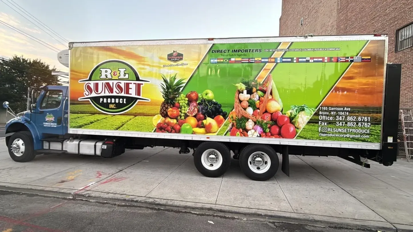 Full vinyl box truck wrap for R&L Sunset Produce featuring vibrant fruit and vegetable graphics, installed by Print & Wrap Studio Corp near Staten Island, NY.