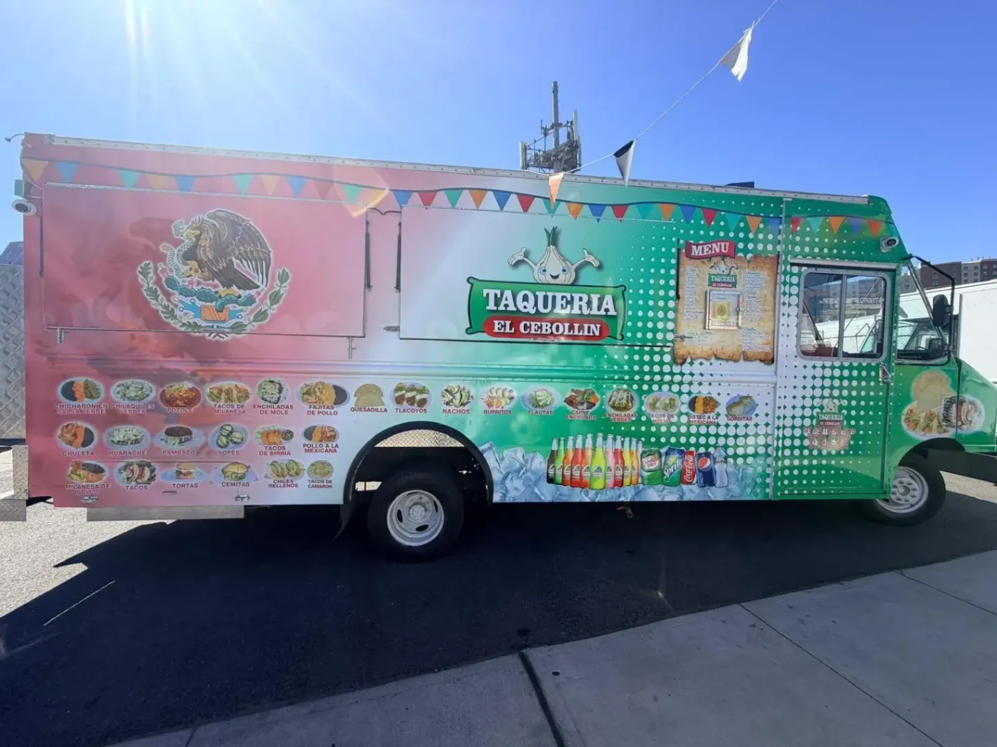 Custom vinyl food truck wrap for Taqueria El Cebollin featuring vibrant Mexican flag graphics and menu photos by Print & Wrap Studio Corp in the Bronx, NY